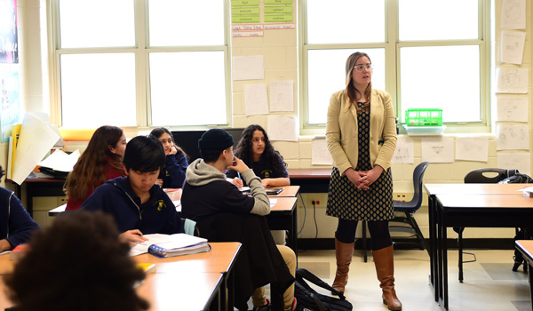 A Catholic ϲapp student gaining hands-on experience teaching in a high school classroom.