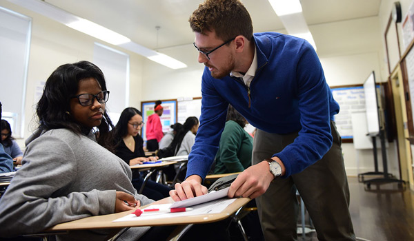 A Catholic ϲapp student gaining hands-on experience teaching in a high school classroom.